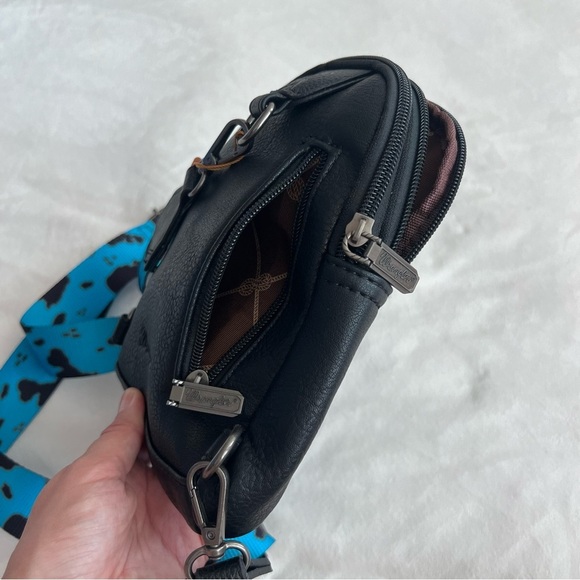 Wrangler Turquoise Cow Print Sling Bag - Picture 9 of 11